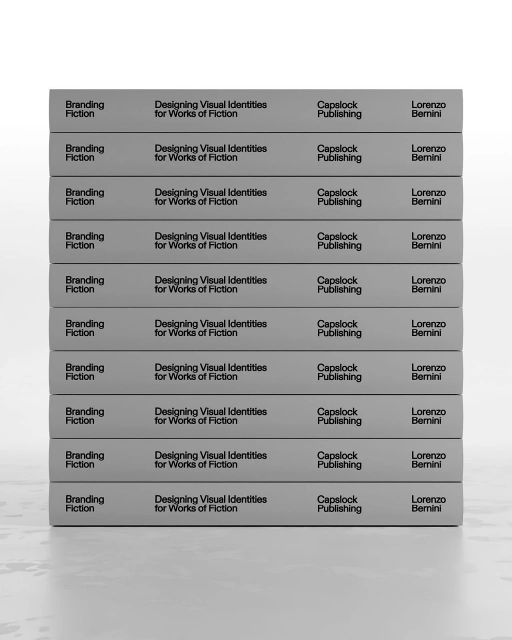 A stack of grey Branding Fiction books with Lorenzo Bernini and CAPSLOCK printed on the spines.