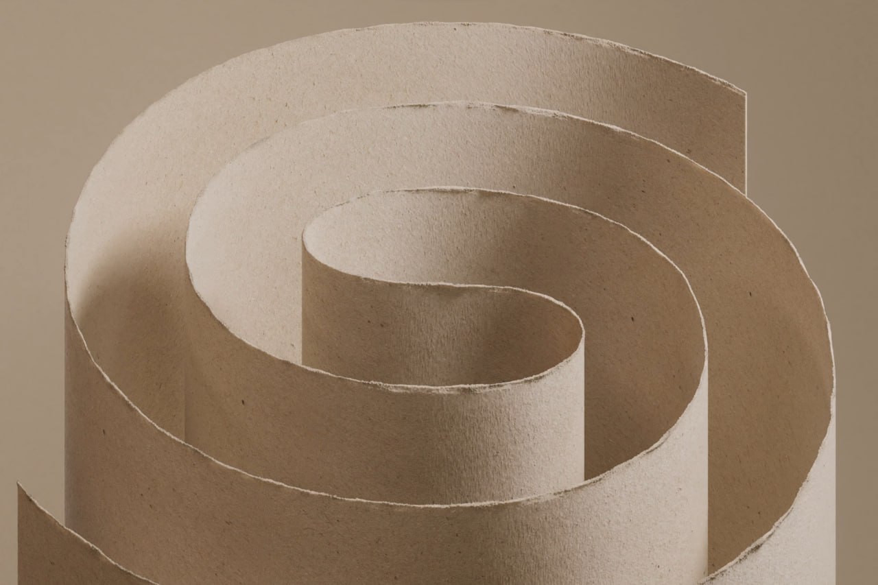 A beige paper strip curled through several bends into an S-like form.